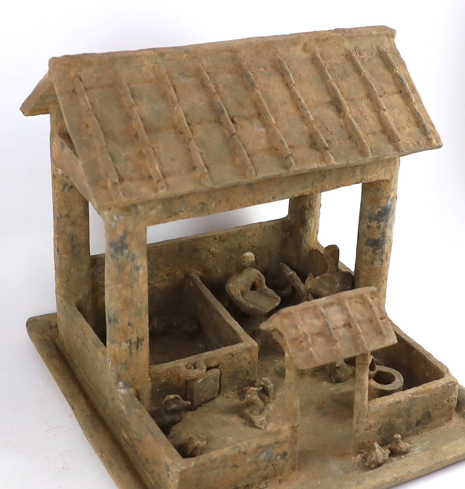 A large Chinese grey pottery model of a farmstead, Han dynasty (200BCE - 220CE), 35cm high 38cm wide 38cm deep
